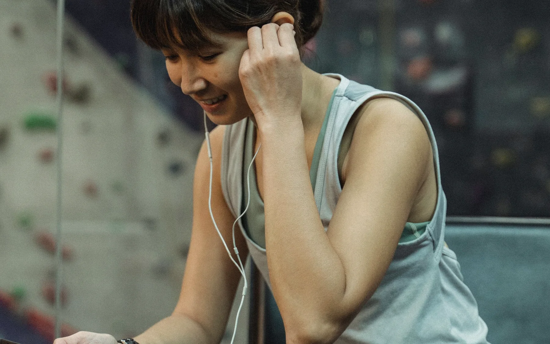 An athlete reviewing her workout information during a training break